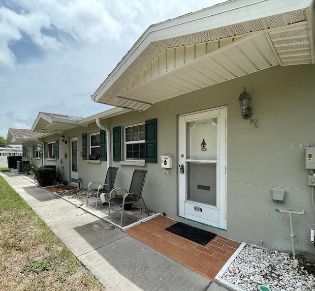 doorway to property featuring central AC