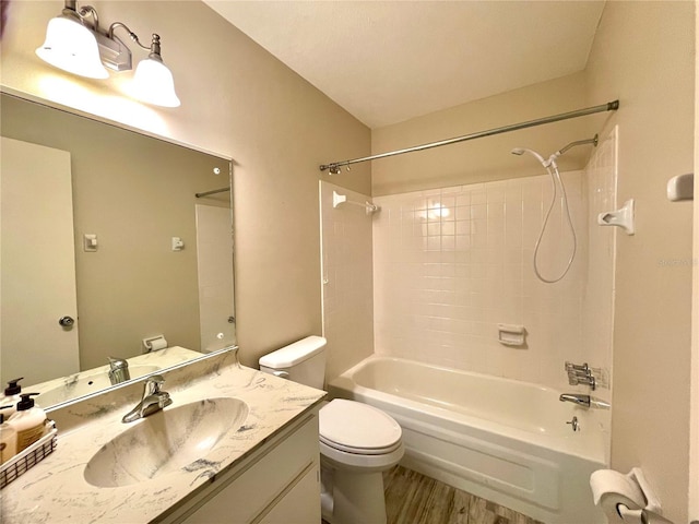 full bathroom with hardwood / wood-style floors, vanity, toilet, and bathtub / shower combination