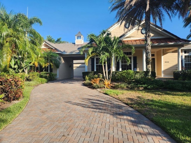 view of front of house with a front lawn and a garage