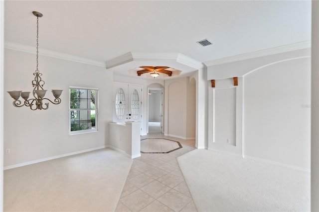 interior space featuring french doors, ceiling fan with notable chandelier, and ornamental molding