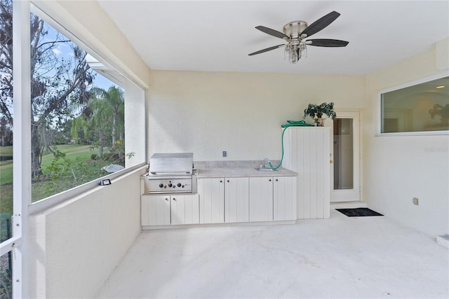 view of patio / terrace with area for grilling and a balcony