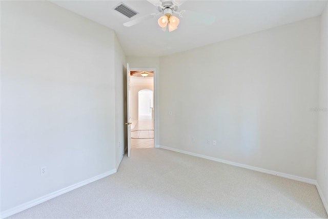 unfurnished room featuring ceiling fan and light colored carpet