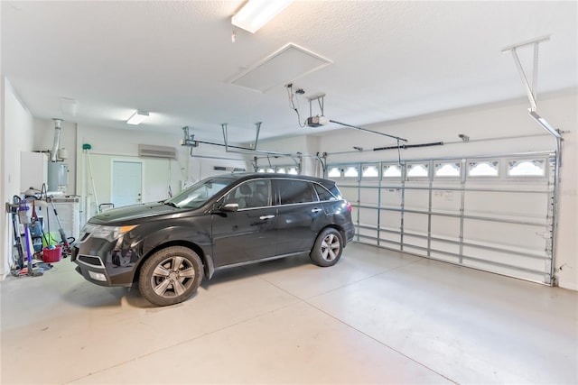 garage with a garage door opener and water heater