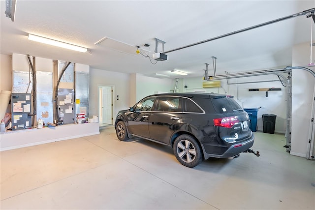 garage with a garage door opener and heating unit