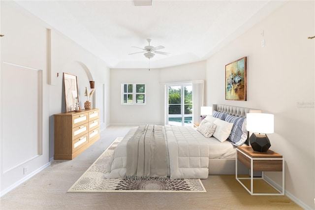 carpeted bedroom featuring access to outside and ceiling fan