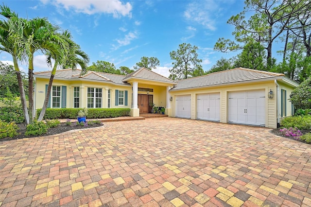 ranch-style home featuring a garage