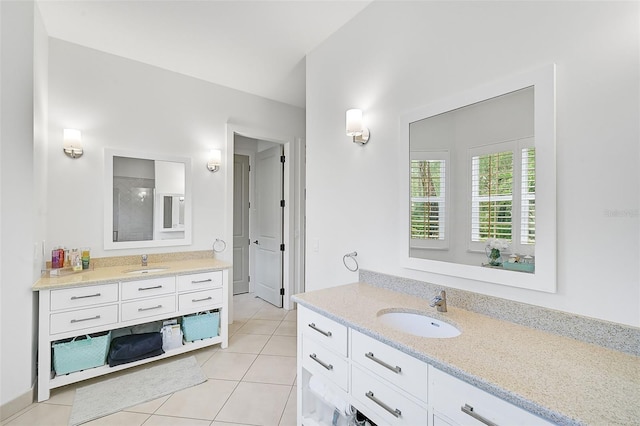 bathroom featuring tile patterned flooring and vanity