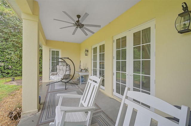 view of patio / terrace featuring ceiling fan and french doors