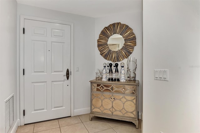 foyer with light tile patterned floors