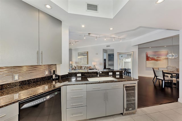 kitchen featuring beverage cooler, sink, dark stone countertops, black dishwasher, and light tile patterned flooring