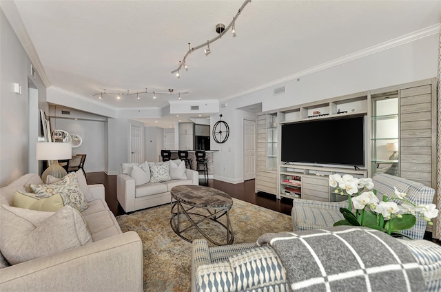 living room with crown molding and hardwood / wood-style flooring