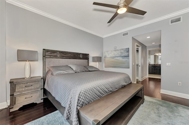 bedroom with ceiling fan, dark hardwood / wood-style flooring, ornamental molding, and connected bathroom