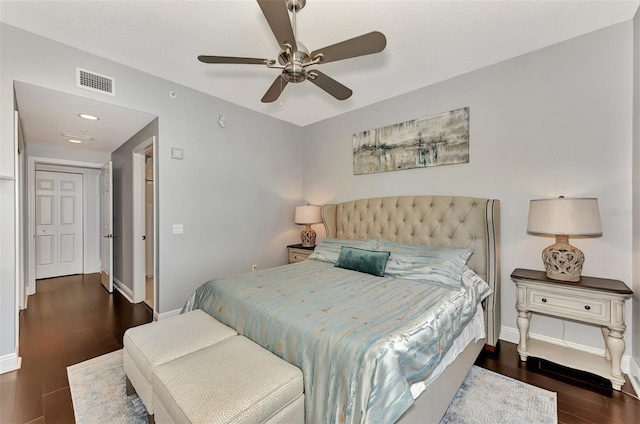 bedroom with ceiling fan and dark wood-type flooring