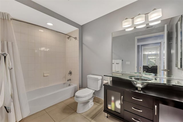 full bathroom featuring tile patterned floors, vanity, shower / bath combo, and toilet