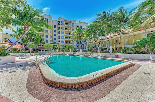 view of swimming pool with a patio