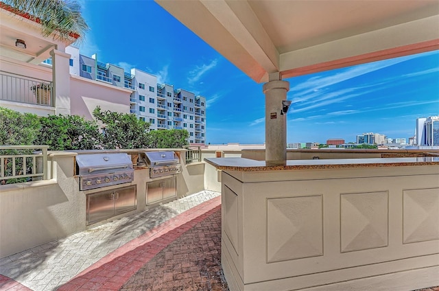 view of patio / terrace with an outdoor kitchen and a grill