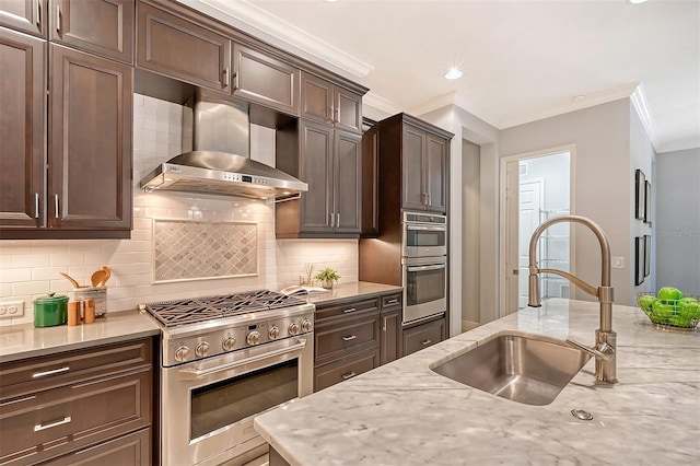 kitchen with ventilation hood, decorative backsplash, sink, and appliances with stainless steel finishes