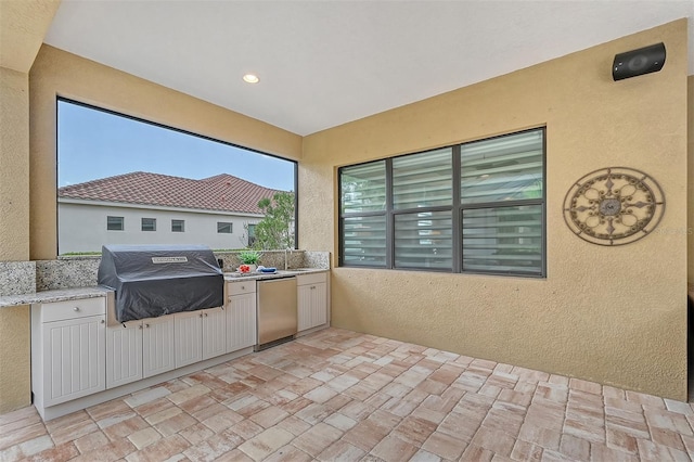 view of patio / terrace featuring area for grilling and exterior kitchen