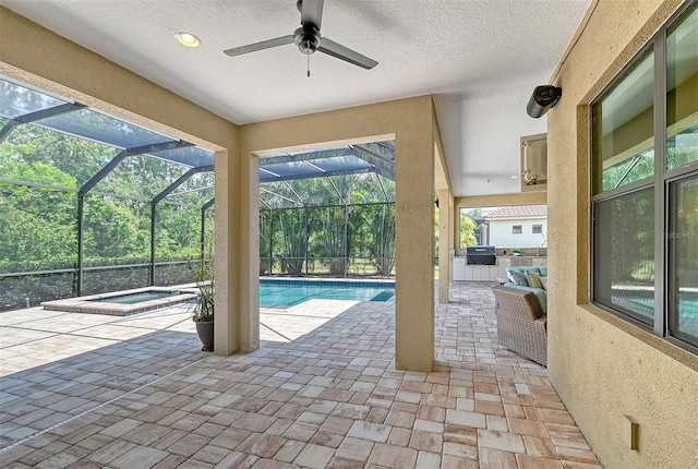 view of pool with glass enclosure, ceiling fan, grilling area, an in ground hot tub, and a patio