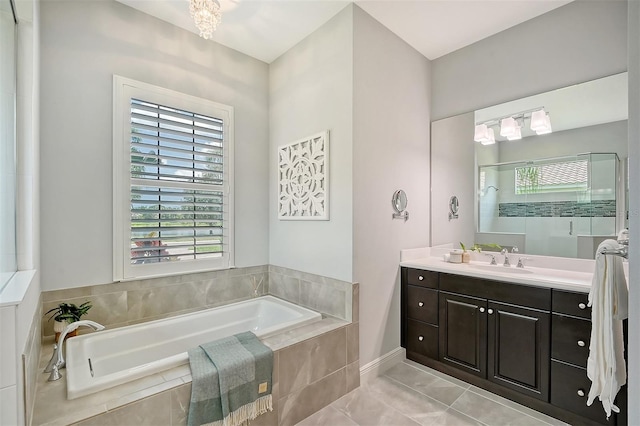 bathroom with vanity, tile patterned floors, and independent shower and bath