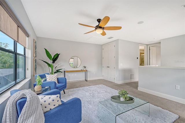 living room featuring ceiling fan and light carpet