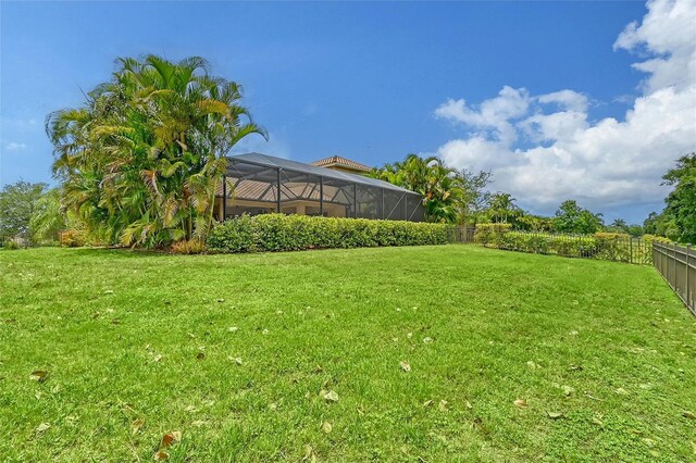 view of yard featuring a lanai