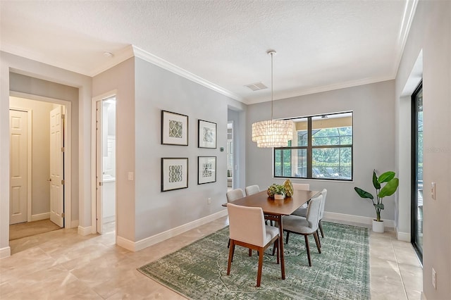 dining room with a textured ceiling, crown molding, and a notable chandelier