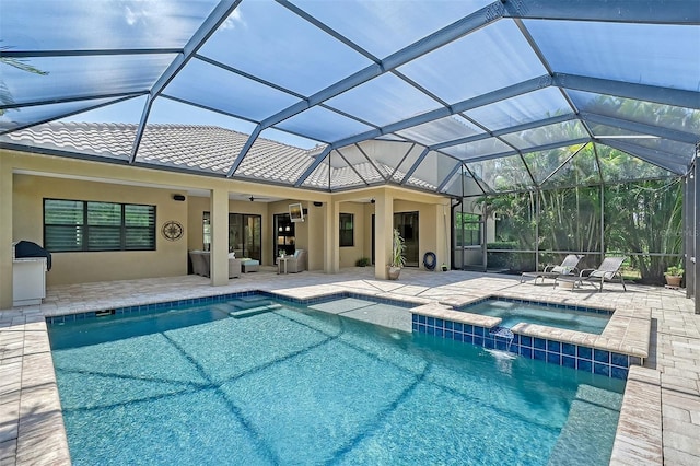 view of pool featuring an in ground hot tub, a patio, ceiling fan, and a lanai