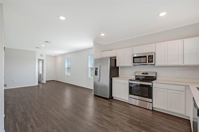 kitchen featuring white cabinets, dark hardwood / wood-style floors, and appliances with stainless steel finishes