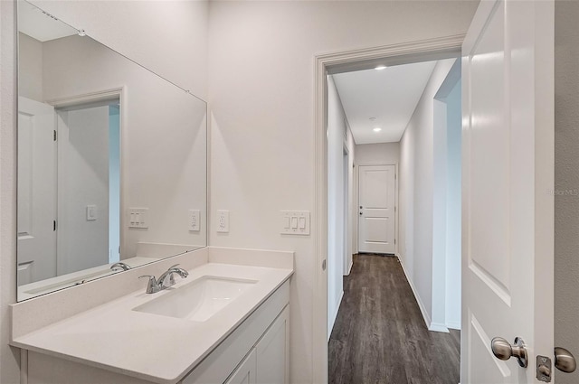 bathroom featuring hardwood / wood-style floors and vanity