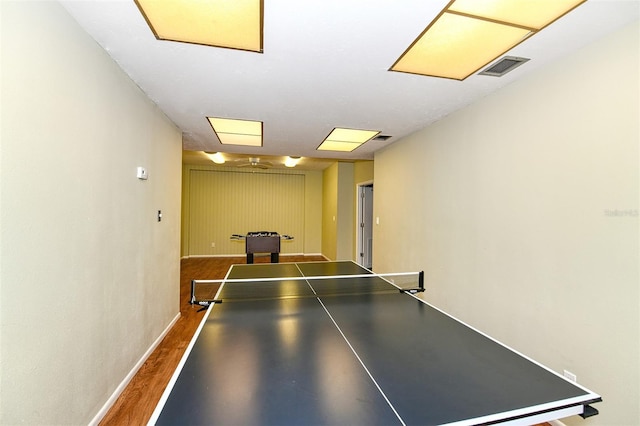 game room featuring dark hardwood / wood-style floors