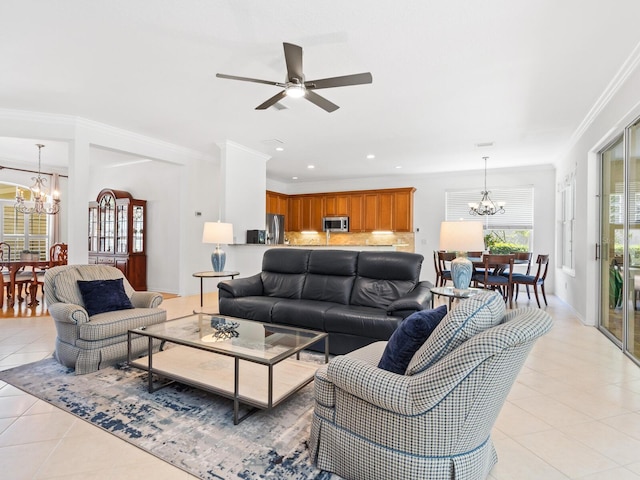 living room with ceiling fan with notable chandelier, light tile patterned floors, and crown molding