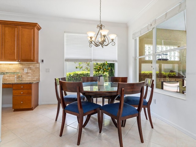 tiled dining room featuring a chandelier and ornamental molding