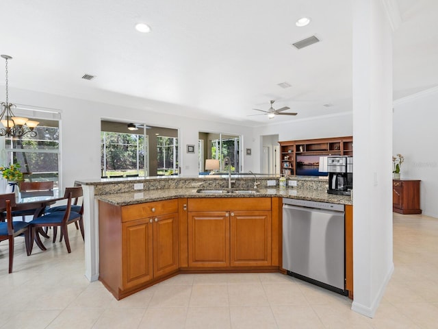 kitchen with pendant lighting, dishwasher, sink, ornamental molding, and stone countertops