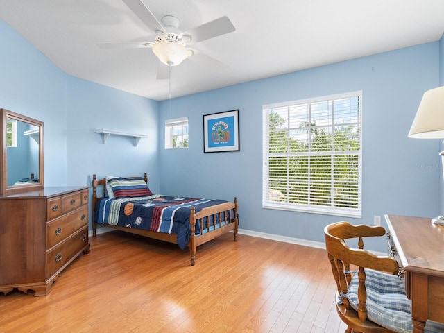 bedroom featuring ceiling fan and light hardwood / wood-style flooring