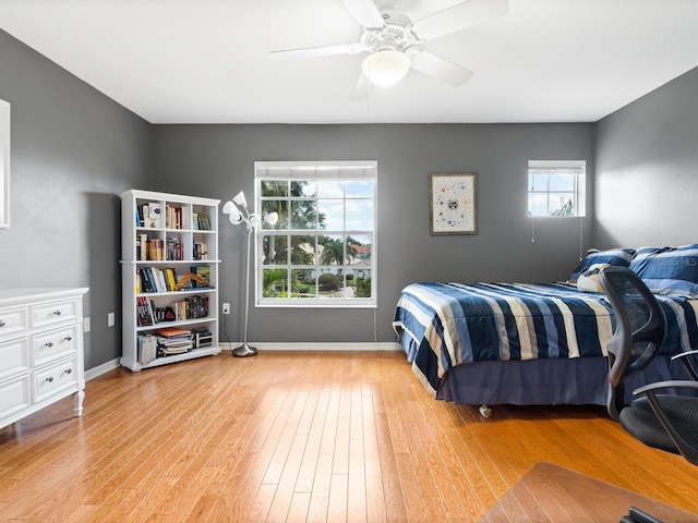 bedroom featuring ceiling fan and light hardwood / wood-style flooring