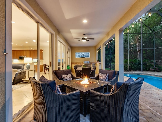 sunroom with a pool and ceiling fan