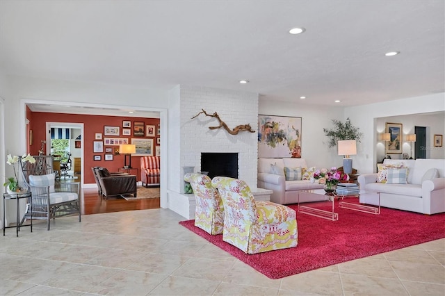 living room featuring light tile patterned floors and a fireplace