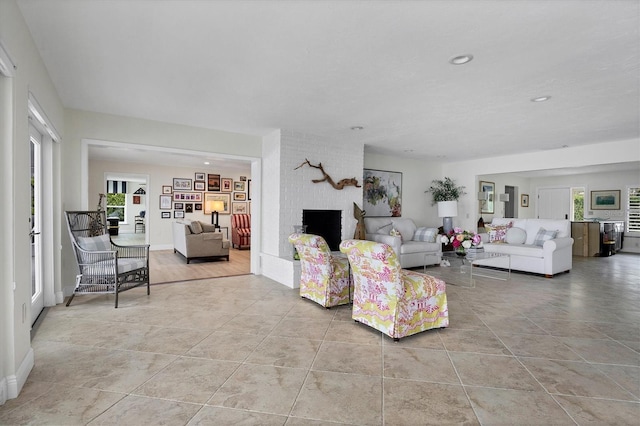 tiled living room with a fireplace