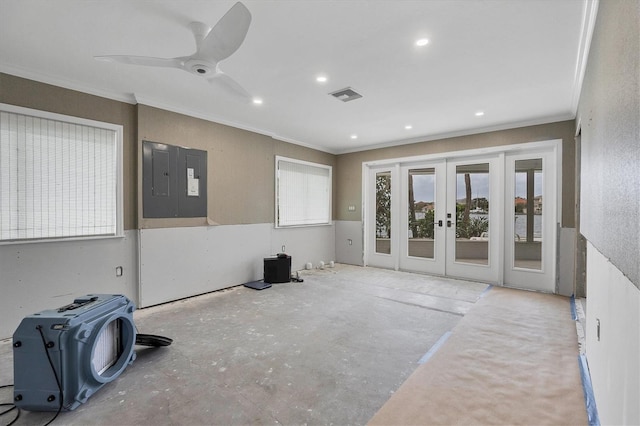 empty room featuring ceiling fan, ornamental molding, and french doors