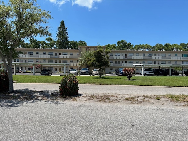 view of property with uncovered parking