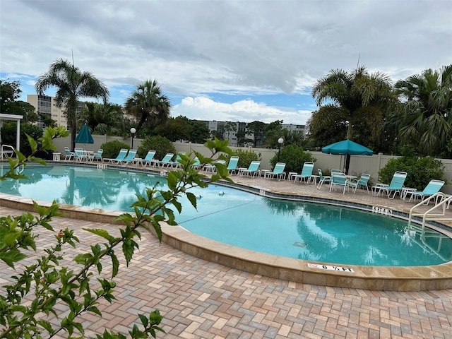 view of swimming pool with a patio area