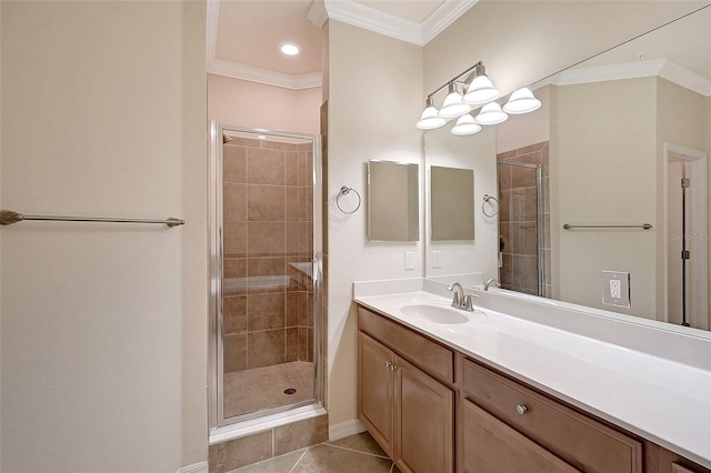 bathroom featuring vanity, tile patterned floors, a shower with door, and crown molding