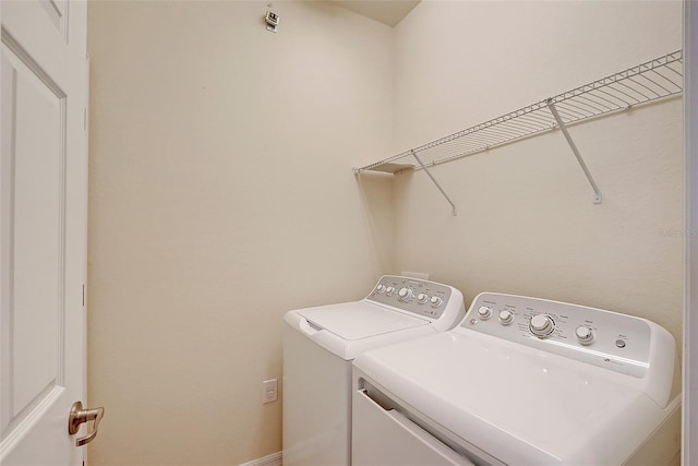 laundry area featuring washing machine and clothes dryer