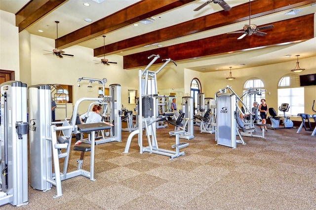 workout area featuring ceiling fan and light colored carpet