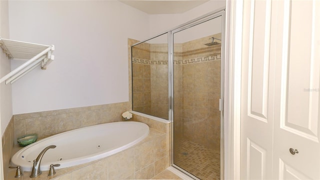 bathroom with separate shower and tub