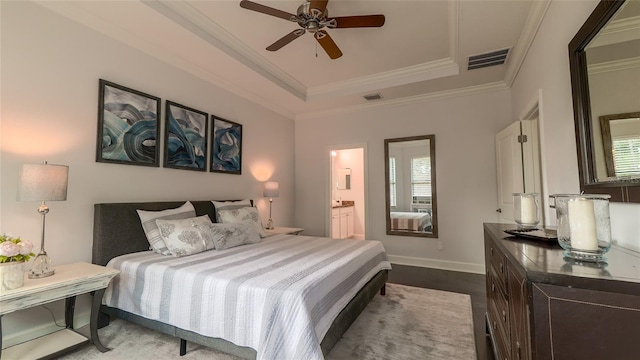 bedroom featuring ceiling fan, light hardwood / wood-style floors, connected bathroom, and multiple windows