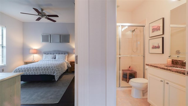 tiled bedroom featuring ceiling fan and sink