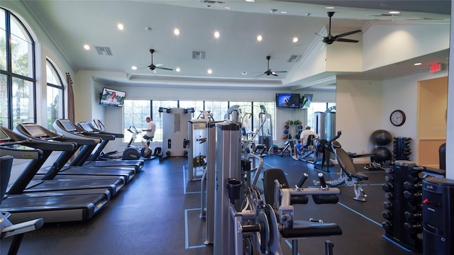 gym with crown molding and lofted ceiling