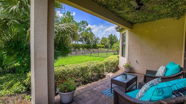 view of patio with ceiling fan and an outdoor hangout area